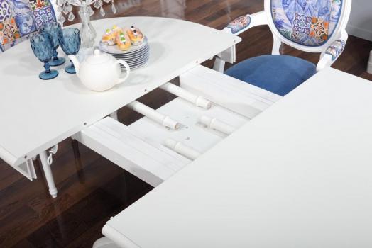 Mesa de comedor ovalada Toledo con una pata central fabricada en madera de Cerezo macizo estilo Louis Philippe 160x120 + 5 extensiones acabado marfil